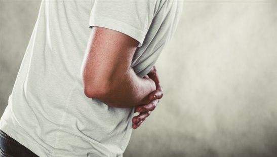 Illustration photo of a man suffering from stomach ache abdominal pain